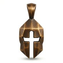 Helm & Cross Pendant close-up detail — hand-finished, available in bronze, sterling silver, and 14k gold