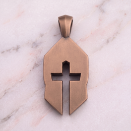 Back of the bronze Women's Cross & Helm on white marble