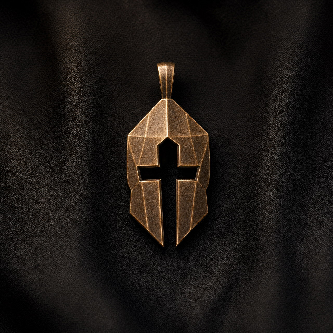 Bronze Cross and Helm pendant on dark fabric