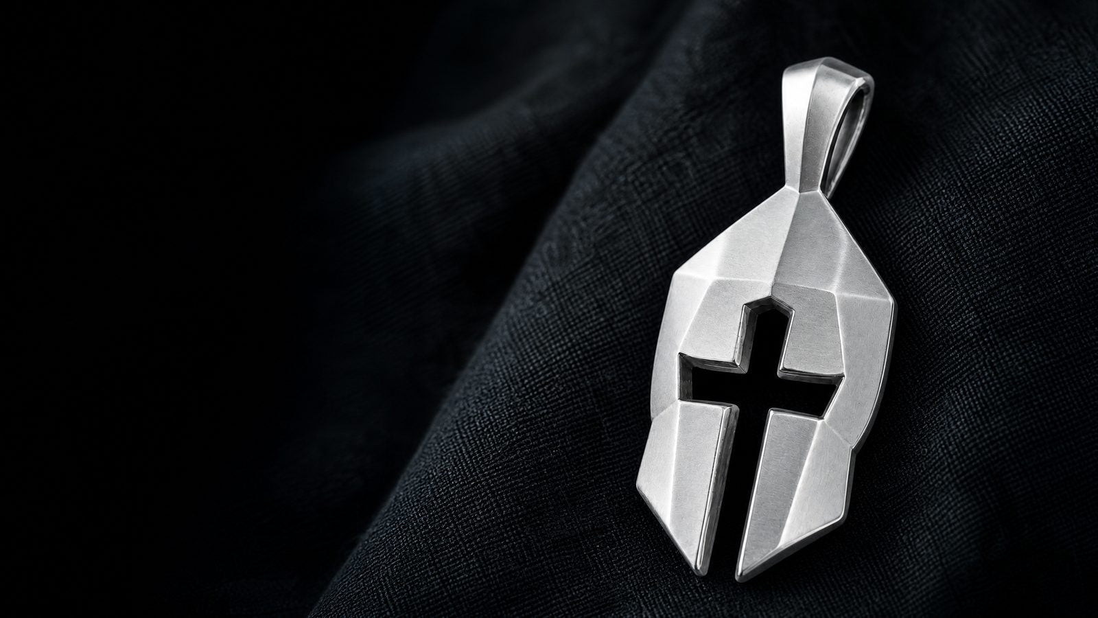 Macro detail of the Cross & Helm pendant hand finished surface