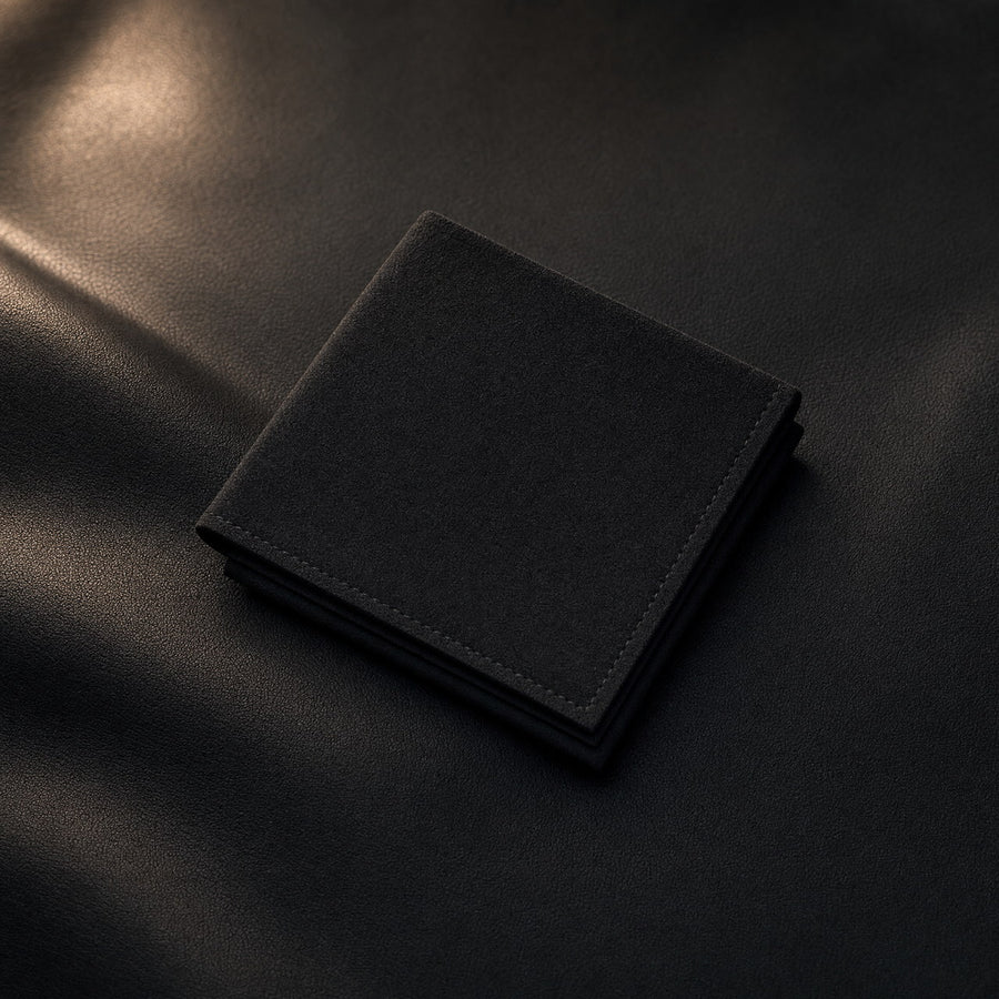 Black microfiber cloth folded into a clean square